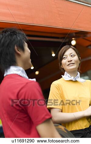 Waiters standing in front of coffee shop View Large Photo Image Stock Image - Waiters standing in front of coffee shop. Fotosearch