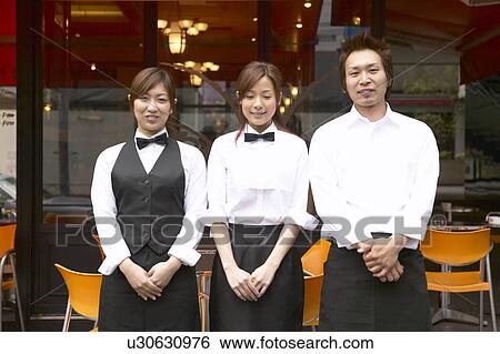 Waiters standing in front of coffee shop View Large Photo Image Stock Photograph - Waiters standing in front of coffee shop. Fotosearch