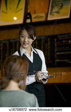 Stock Image - Waitress taking order. Fotosearch