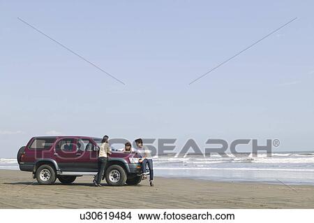 Picture - Car parked on beach. Fotosearch