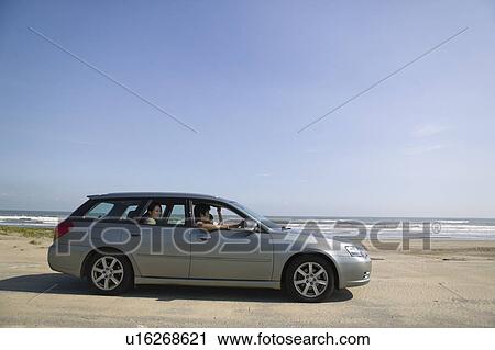 Car parked on beach View Large Photo Image Stock Image - Car parked on beach. Fotosearch