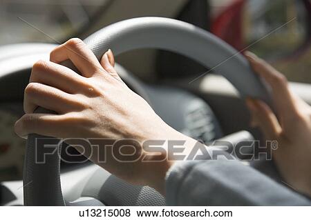 Close-up of woman's hand on wheel View Large Photo Image Stock Photo - Close-up of woman's hand on wheel. Fotosearch