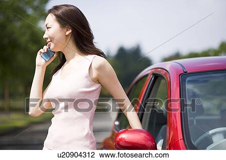 Young woman using mobile phone View Large Photo Image Stock Image - Young woman using mobile phone. Fotosearch