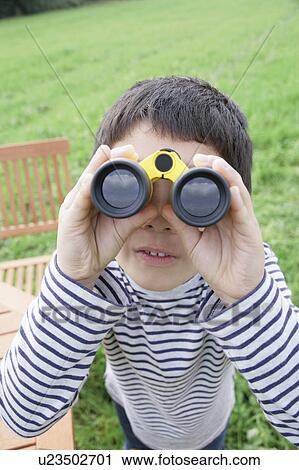 Boy using binoculars View Large Photo Image Stock Image - Boy using binoculars. Fotosearch