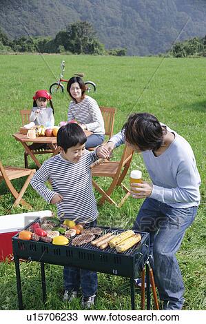 Family having barbeque View Large Photo Image Stock Image - Family having barbeque. Fotosearch