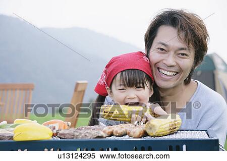 Father and daughter having barbeque View Large Photo Image Stock Photography - Father and daughter having barbeque. Fotosearch