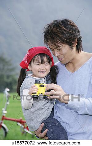 Father and daughter using binoculars View Large Photo Image Stock Image - Father and daughter using binoculars. Fotosearch