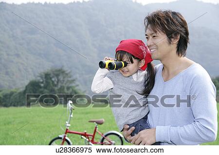 Father and daughter using binoculars View Large Photo Image Stock Photography - Father and daughter using binoculars. Fotosearch