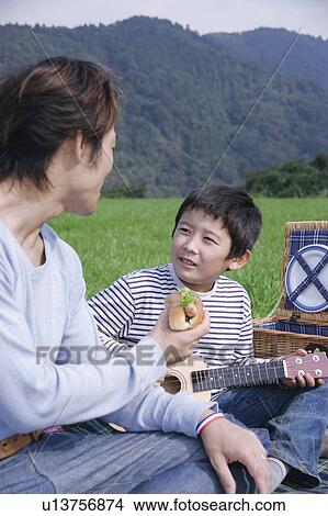 Father and son having picnic View Large Photo Image Picture - Father and son having picnic. Fotosearch