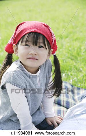 Stock Image - Girl wearing bandana. Fotosearch