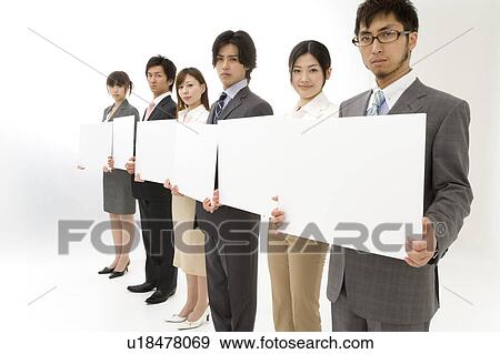 Stock Photo - Business people holding blank placards. Fotosearch