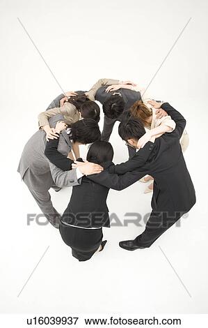 Business people huddled in circle View Large Photo Image Stock Photo - Business people huddled in circle. Fotosearch