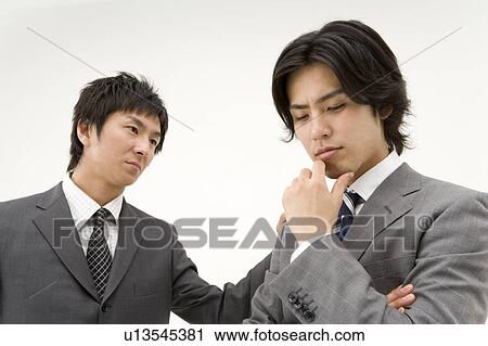 Businessman consoling his colleague View Large Photo Image Stock Image - Businessman consoling his colleague. Fotosearch