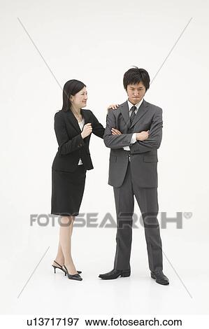 Stock Photo - Businesswoman consoling her colleague. Fotosearch