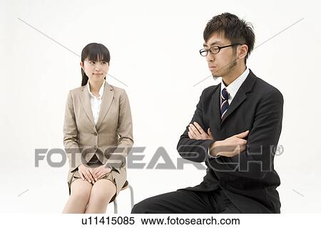 Two business people sitting View Large Photo Image Stock Photography - Two business people sitting. Fotosearch