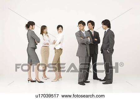 Business people glaring at each other View Large Photo Image Stock Photo - Business people glaring at each other. Fotosearch