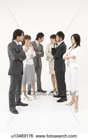 Business people glaring at each other View Large Photo Image Stock Photograph - Business people glaring at each other. Fotosearch