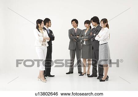 Business people glaring at each other View Large Photo Image Stock Photograph - Business people glaring at each other. Fotosearch