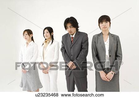 Stock Photo - Businessman among three businesswomen. Fotosearch