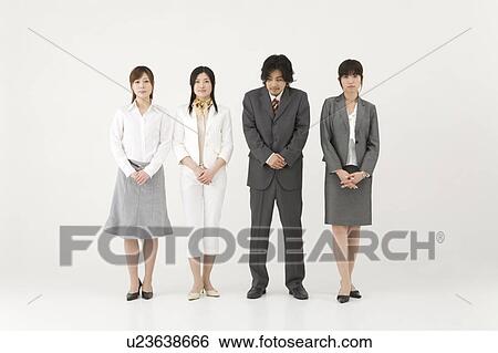 Stock Photograph - Businessman among three businesswomen. Fotosearch