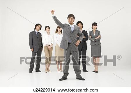 Picture - Businessman and his colleagues. Fotosearch