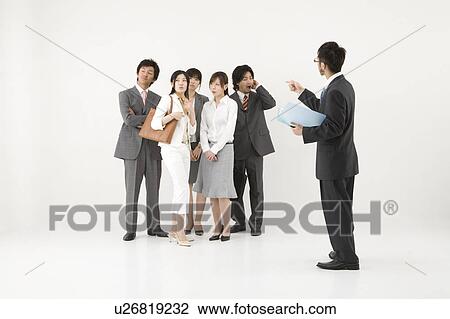Businessman excluded from group of business people View Large Photo Image Stock Image - Businessman excluded from group of business people. Fotosearch