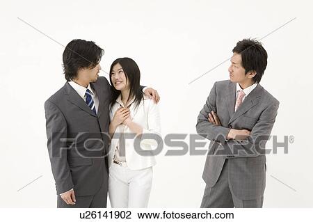 Businessman looking at couple View Large Photo Image Stock Image - Businessman looking at couple. Fotosearch