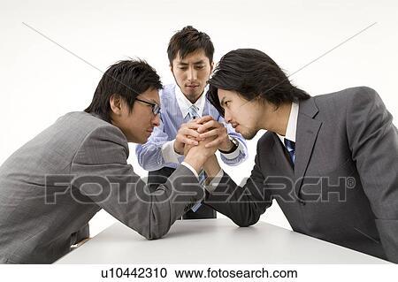 Businessmen arm wrestling View Large Photo Image Stock Image - Businessmen arm wrestling. Fotosearch