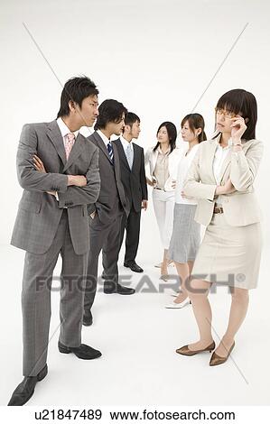 Stock Photo - Businessmen opposite businesswomen. Fotosearch