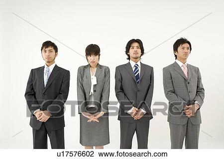 Businesswoman among three businessmen View Large Photo Image Stock Image - Businesswoman among three businessmen. Fotosearch