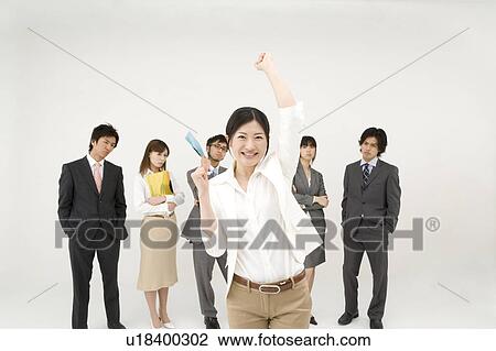 Stock Image - Businesswoman and her colleagues. Fotosearch