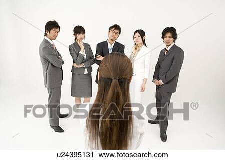 Businesswoman excluded from group of business people View Large Photo Image Stock Image - Businesswoman excluded from group of business people. Fotosearch