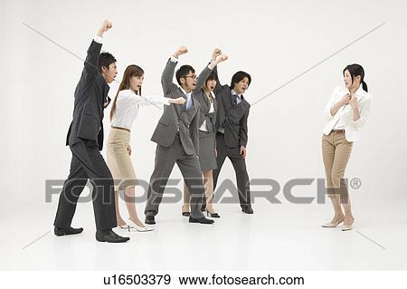 Stock Photo - Group of business people shouting at colleague. Fotosearch
