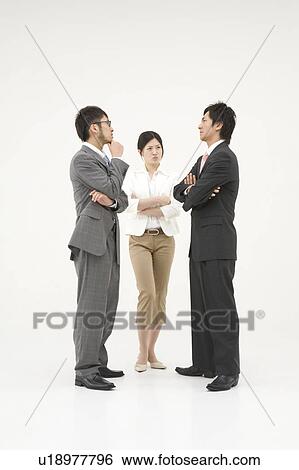 Three business people glaring at each other View Large Photo Image Stock Photograph - Three business people glaring at each other. Fotosearch