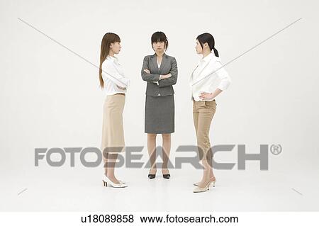 Three businesswomen glaring at each other View Large Photo Image Stock Photo - Three businesswomen glaring at each other. Fotosearch