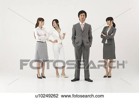 Three businesswomen looking at businessman View Large Photo Image Stock Image - Three businesswomen looking at businessman. Fotosearch