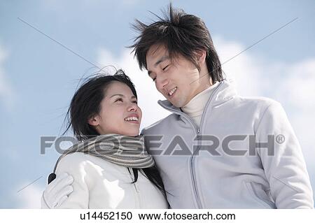Stock Image - Young couple smiling. Fotosearch
