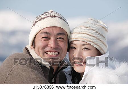 Stock Photograph - Young couple smiling. Fotosearch