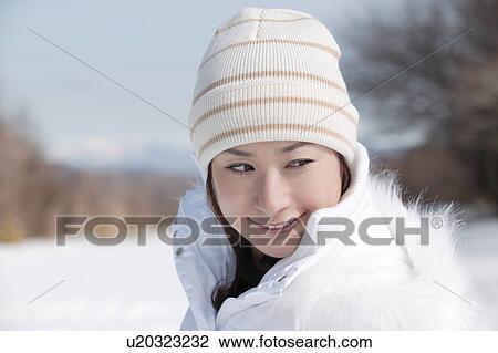 Stock Image - Young woman smiling. Fotosearch