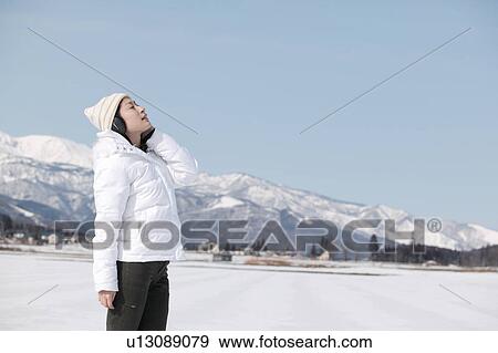 Young woman wearing headphones View Large Photo Image Stock Photo - Young woman wearing headphones. Fotosearch