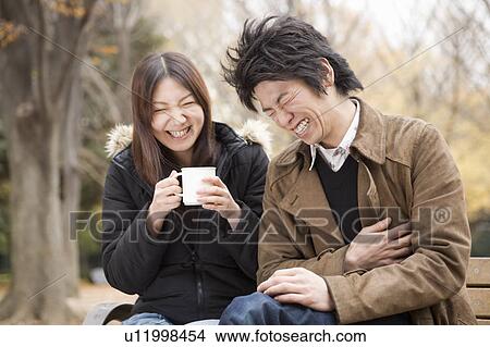 Picture - Young couple laughing. Fotosearch