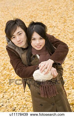 Young couple looking at camera View Large Photo Image Stock Photo - Young couple looking at camera. Fotosearch