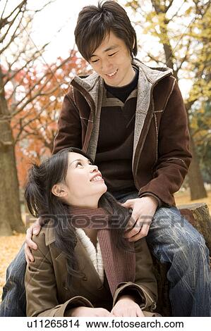 Picture - Young couple looking at each other. Fotosearch