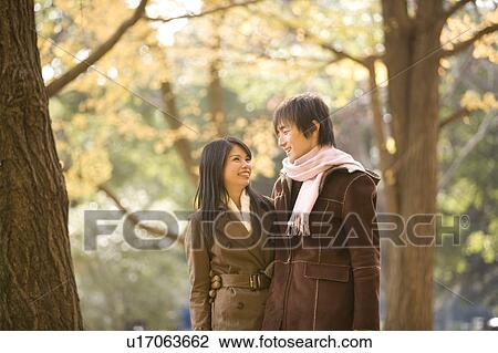 Stock Image - Young couple looking at each other. Fotosearch