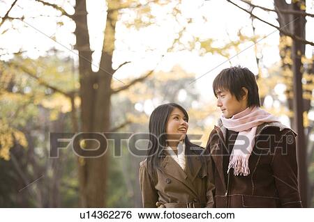 Stock Photograph - Young couple looking at each other. Fotosearch