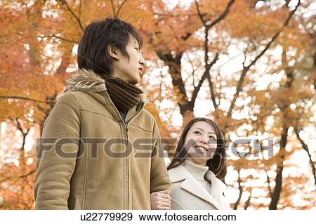 Stock Photo - Young couple walking. Fotosearch