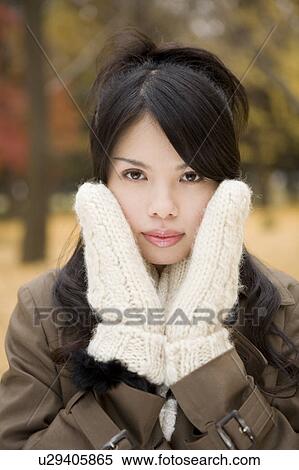 Young woman looking at camera View Large Photo Image Stock Photography - Young woman looking at camera. Fotosearch