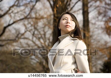 Stock Photography - Young woman standing. Fotosearch