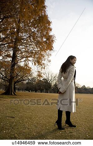 Young woman walking View Large Photo Image Stock Photo - Young woman walking. Fotosearch