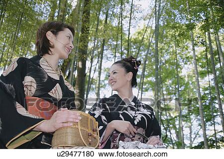 Two young women in kimono sitting View Large Photo Image Stock Image - Two young women in kimono sitting. Fotosearch